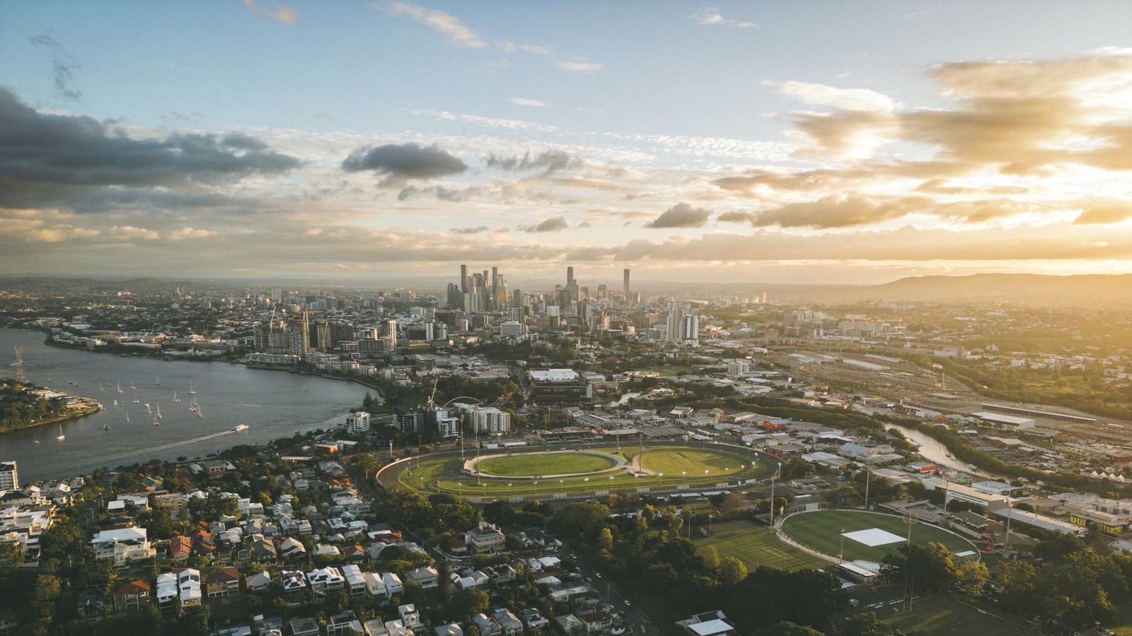 A wide cinematic view of the Brisbane city center and river
