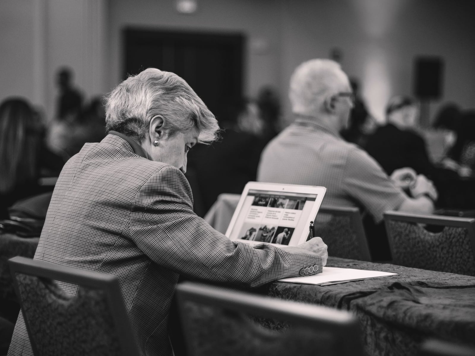 Digital devices on a marble table showing a corporate press release draft
