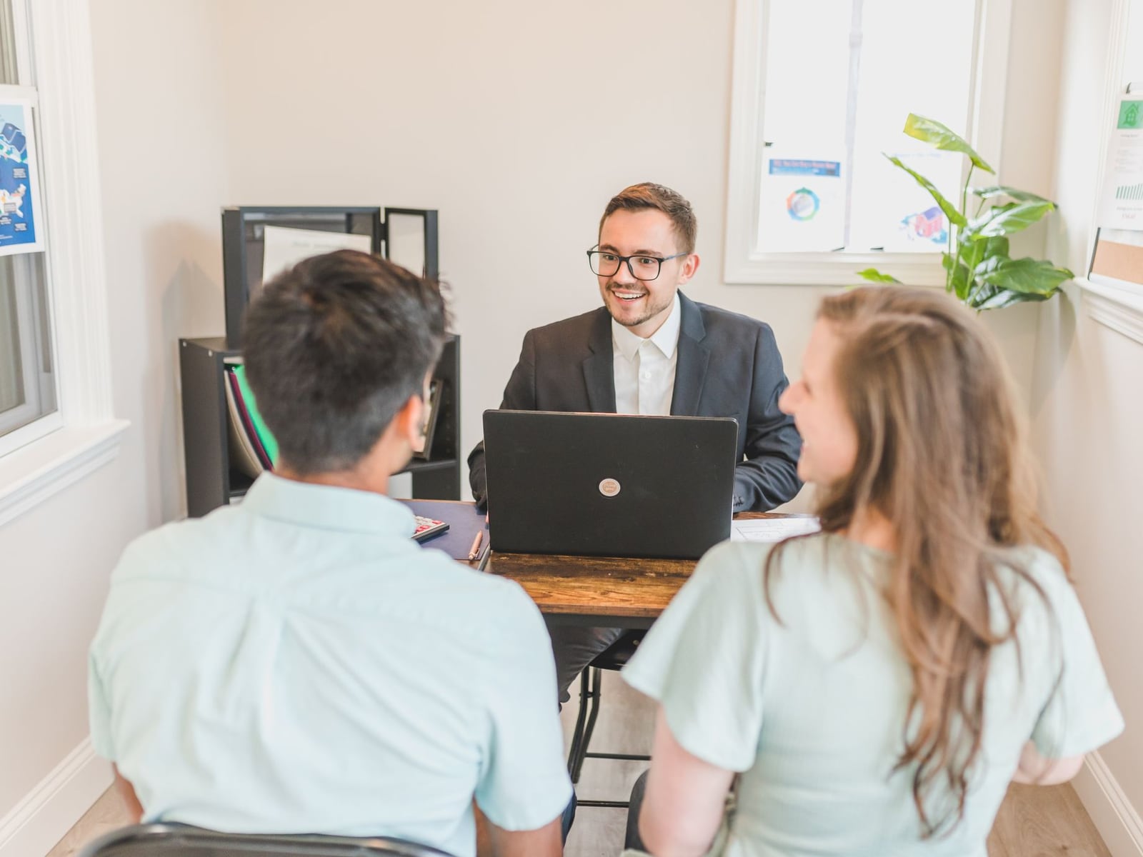 An editor and a client reviewing website copy and structure in a professional setting